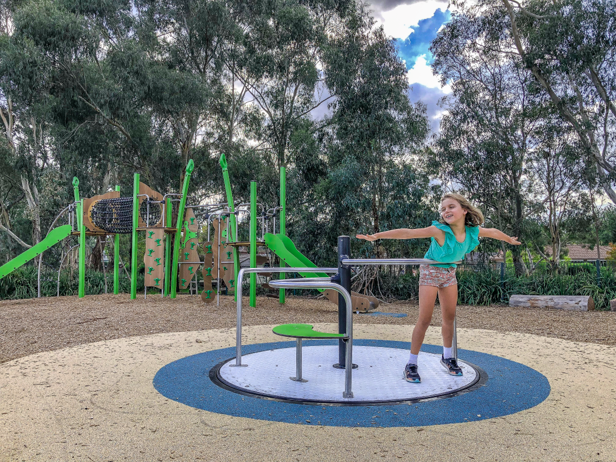 Girl on roundabout at Karoo Reserve Playground