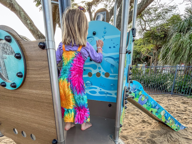 Child playing with manipulative panel