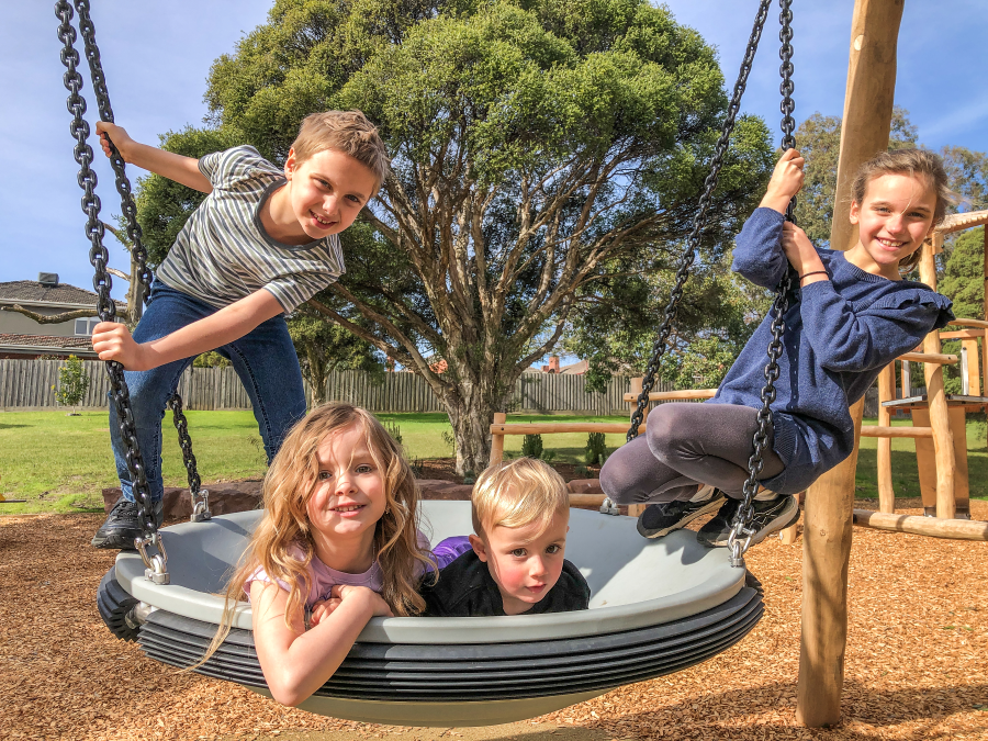 Children playing on Origin' Pod Swing at Sydare Reserve Playground